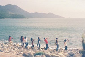 Friends playing on the beach