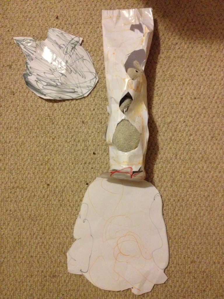 Top left is the moon, on the right is a space rocket. Those are flames and smoke coming out the bottom of the rocket. both are creations of the five year old Helen Adams.