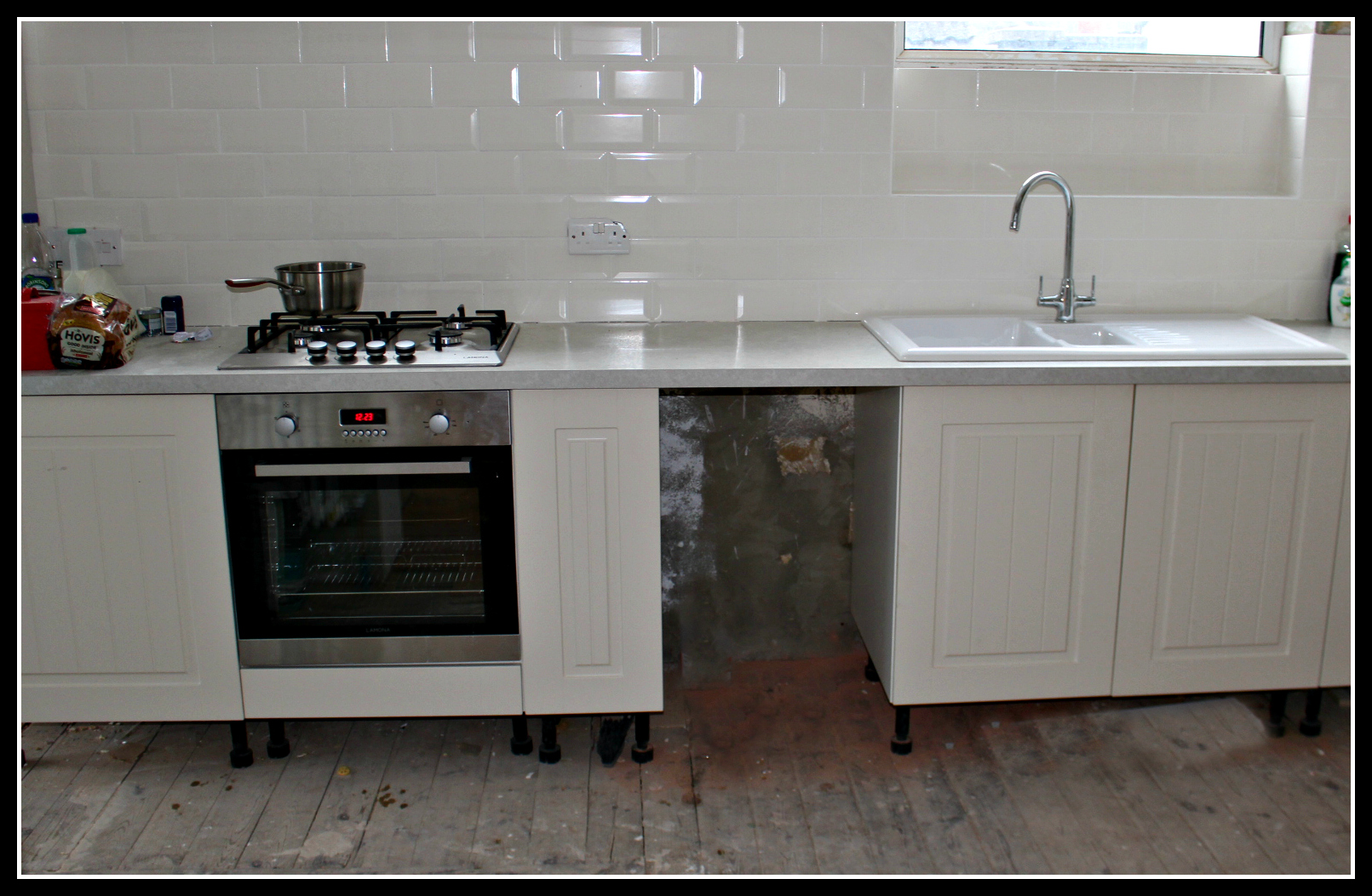 kitchen with sink across from oven