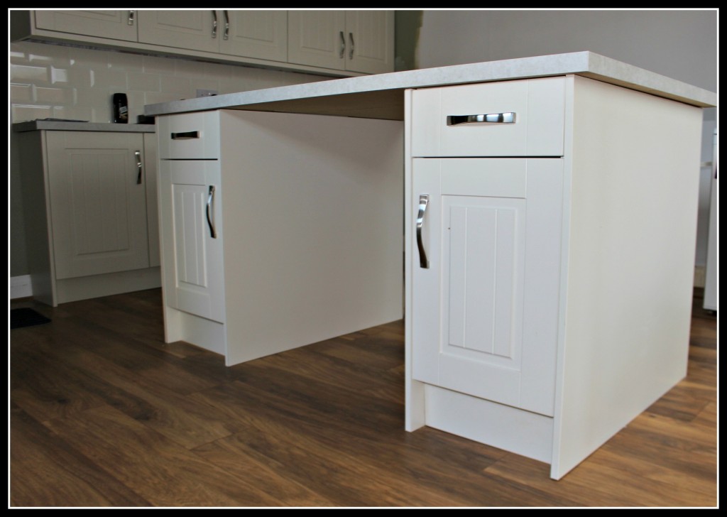 New Kitchen Installing The Flooring, Should You Put Laminate Flooring Under Kitchen Cabinets