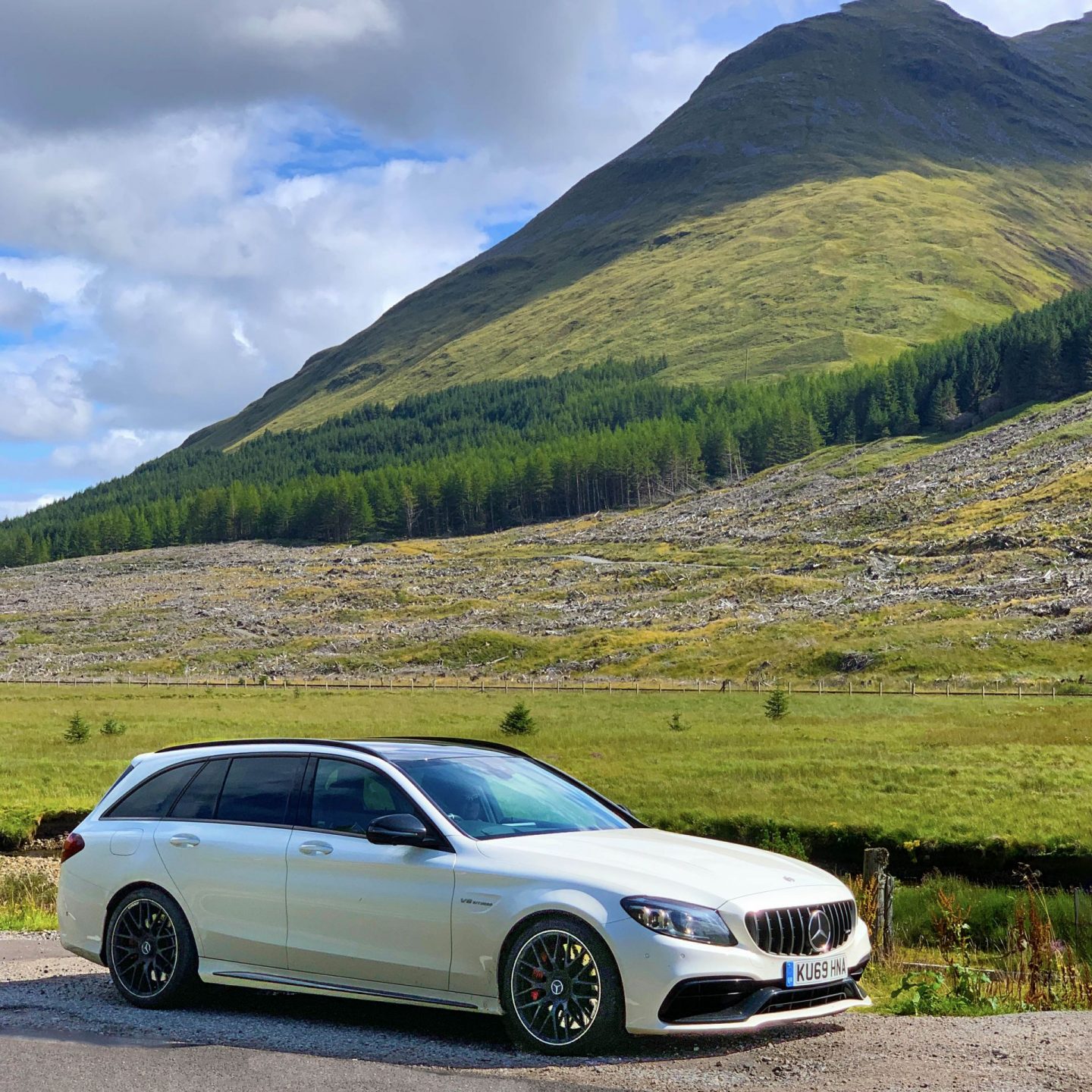 A Mercedes-AMG C 63 parked at the side of the road in Scotland.