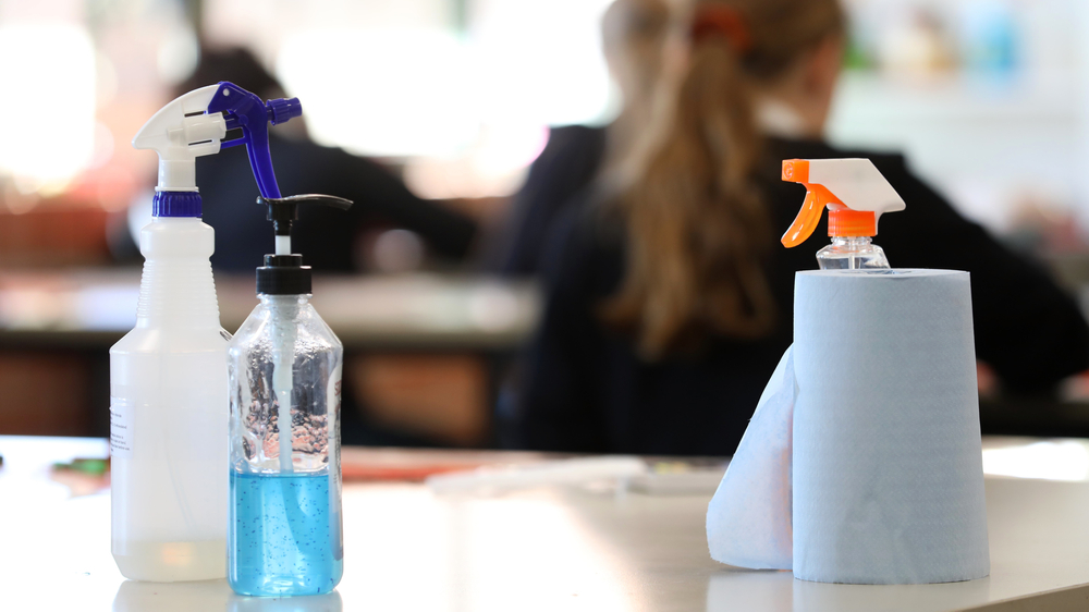 Reflections on starting Year 7. A table with hand sanisitier and disinfectant on top of it. 