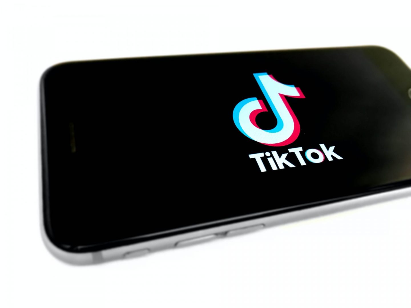 TikTok family pairing: TikTok logo on a  phone.