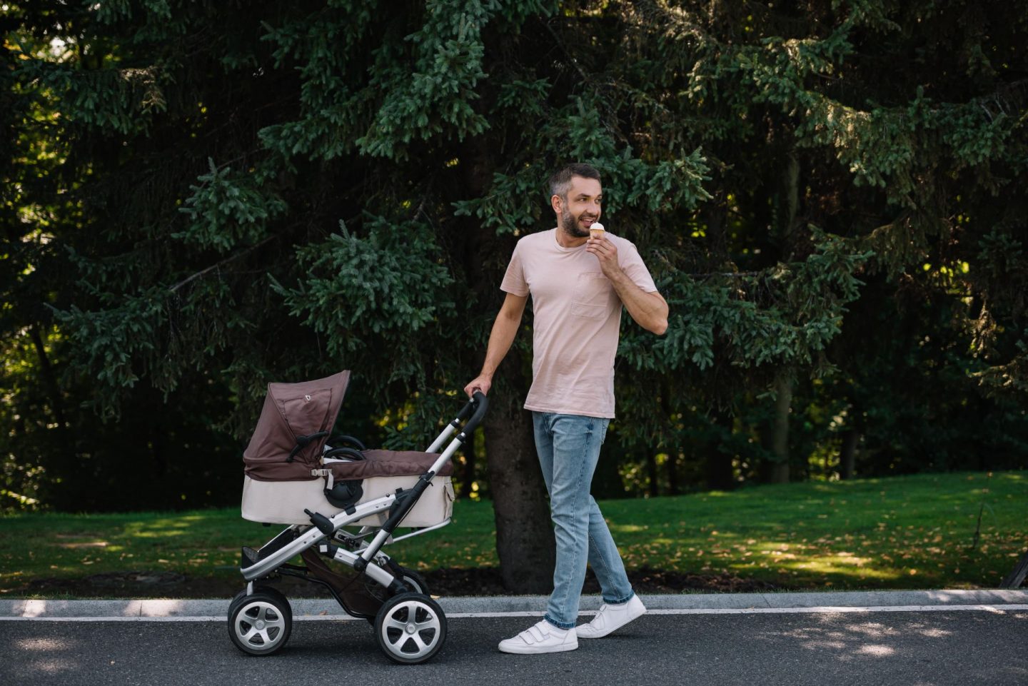 Father pushing a pram. Earn money with Y'earn or earn money renting out baby and child products.