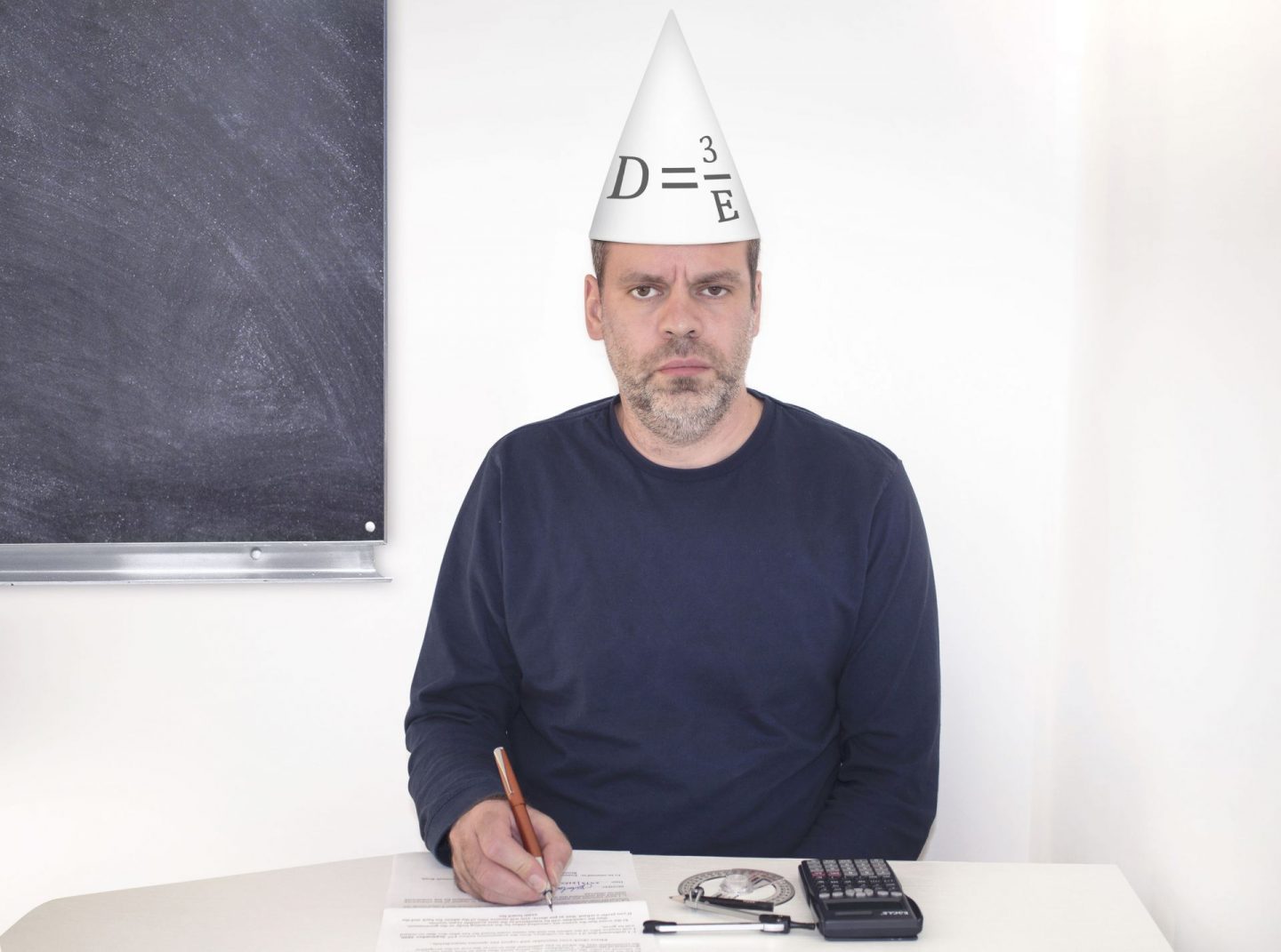 GCSE maths, man in dunces hat